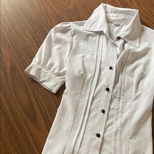 Chic White Button-Up Blouse with Black Accents